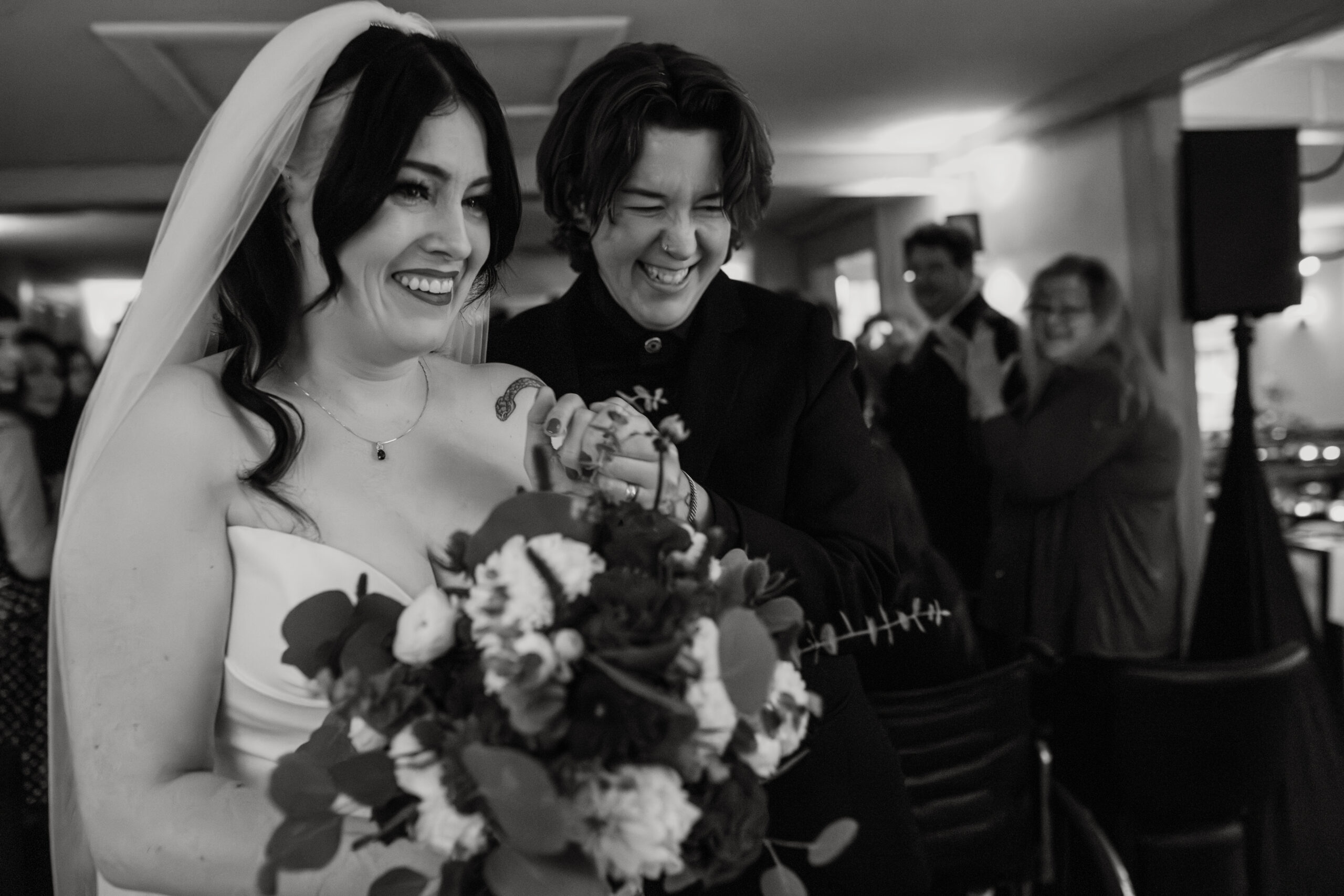 Two brides leave their ceremony after exchanging vows at the 1754 House